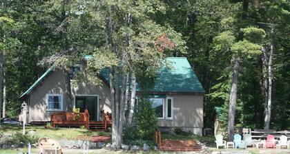 Wonderful house on sandy beach, sports lake close to golf, bike/snowmobile trail