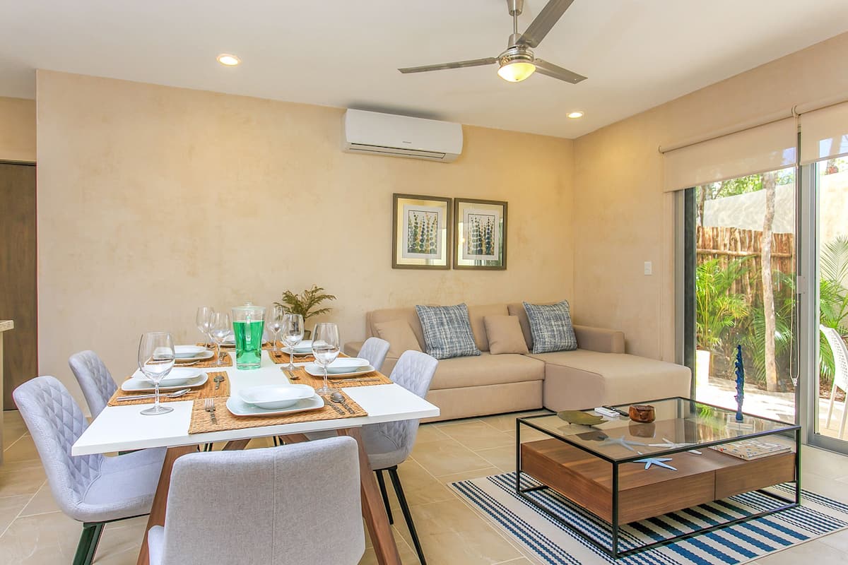 Premier Apartment, 2 Bedrooms, Patio | Living area | Flat-screen TV