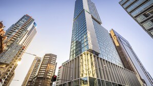 A modern high-rise building with a glass facade and a unique architectural design. - voco Auckland City Centre by IHG (Auckland)