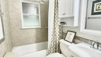 Combined shower/tub, hair dryer, towels, soap