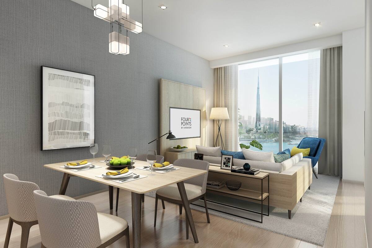 A modern living room with a dining area, a sofa set, and a view of a cityscape.