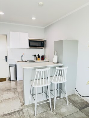 Fridge, microwave, stovetop, coffee/tea maker