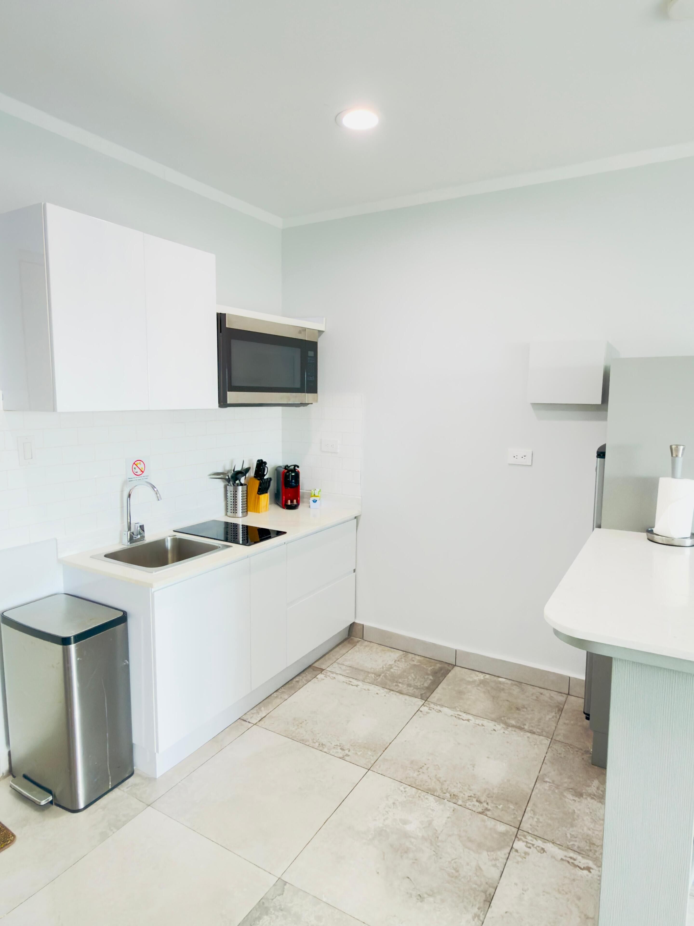 Fridge, microwave, stovetop, coffee/tea maker