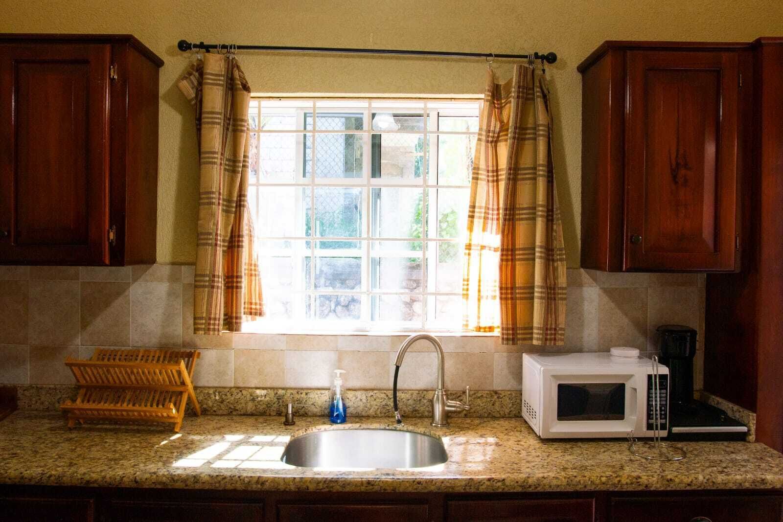 Microwave, coffee/tea maker, cookware/dishes/utensils