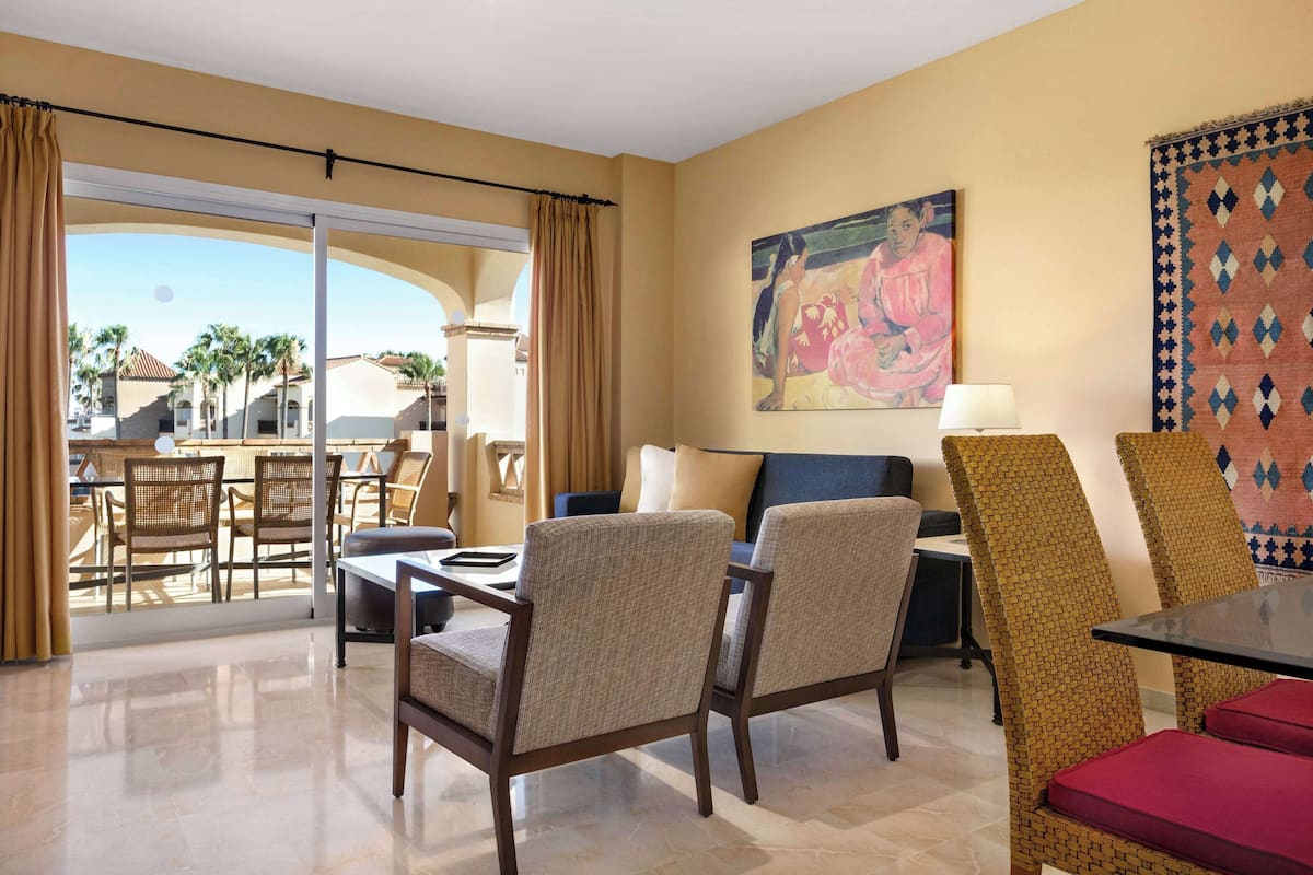 Deluxe Suite, 2 Bedrooms, Sea View | 2 bedrooms, in-room safe, individually decorated, desk