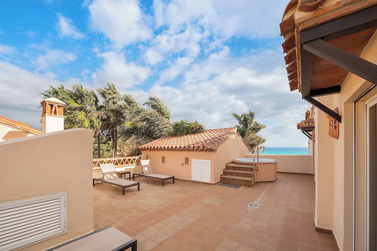 Premium Suite, 2 Bedrooms, Hot Tub (Plus) | 2 bedrooms, in-room safe, individually decorated, desk