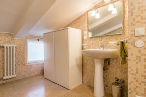 Bathtub, hair dryer, bidet