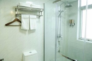 A modern bathroom with a glass-enclosed shower, a towel rack with a wooden hanger, and a toilet. - Kaiyuanbinguan (Wuhu)