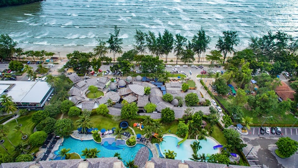 An aerial view of a resort with a large swimming pool, palm trees, and a beach. - Holiday Ao Nang Beach Resort Krabi (Krabi)