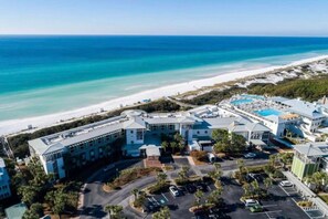 A resort with a pool, beach access, and a parking lot. - WaterColor-Santa Rosa.  Golf Cart, 2 min from beach, Community Pools (Santa Rosa Beach)