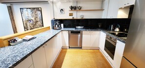 Dishwasher, coffee/tea maker, dining tables
