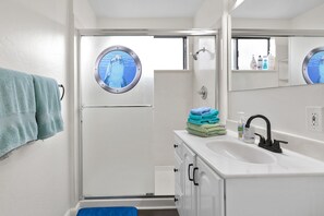 Bathtub, hair dryer, towels, soap