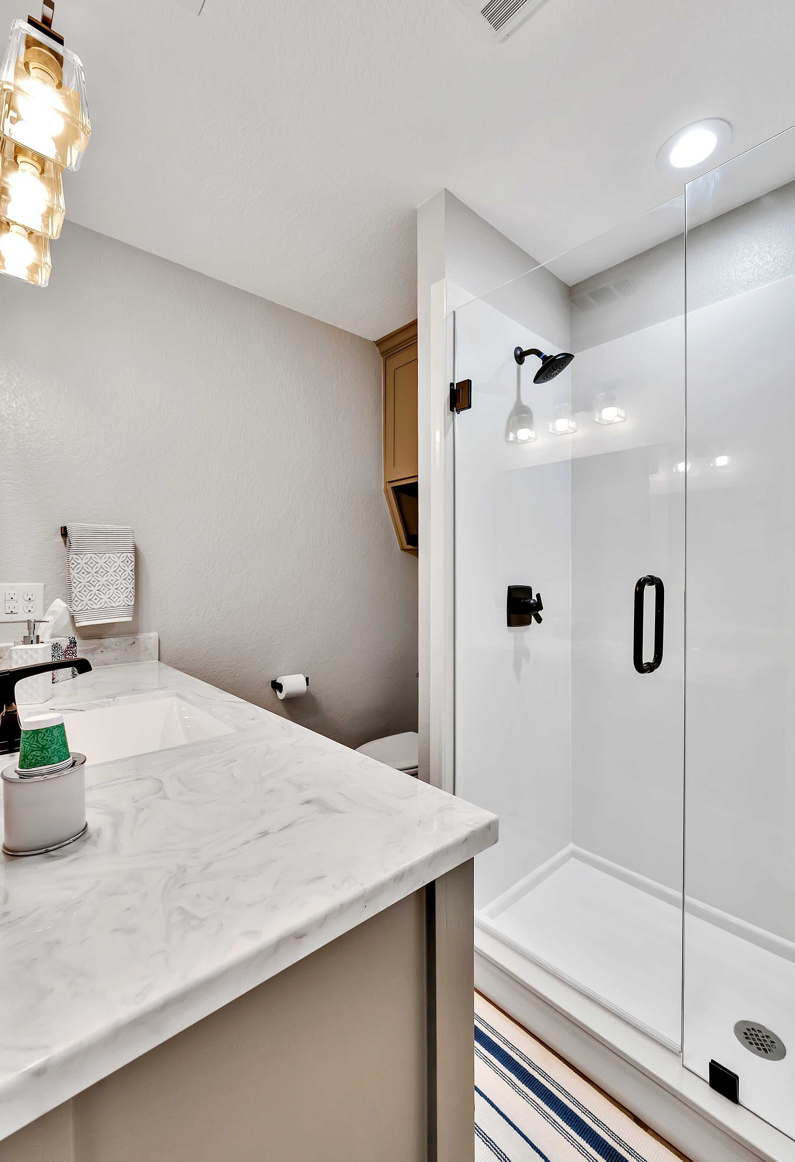 Shower, hair dryer, towels, soap