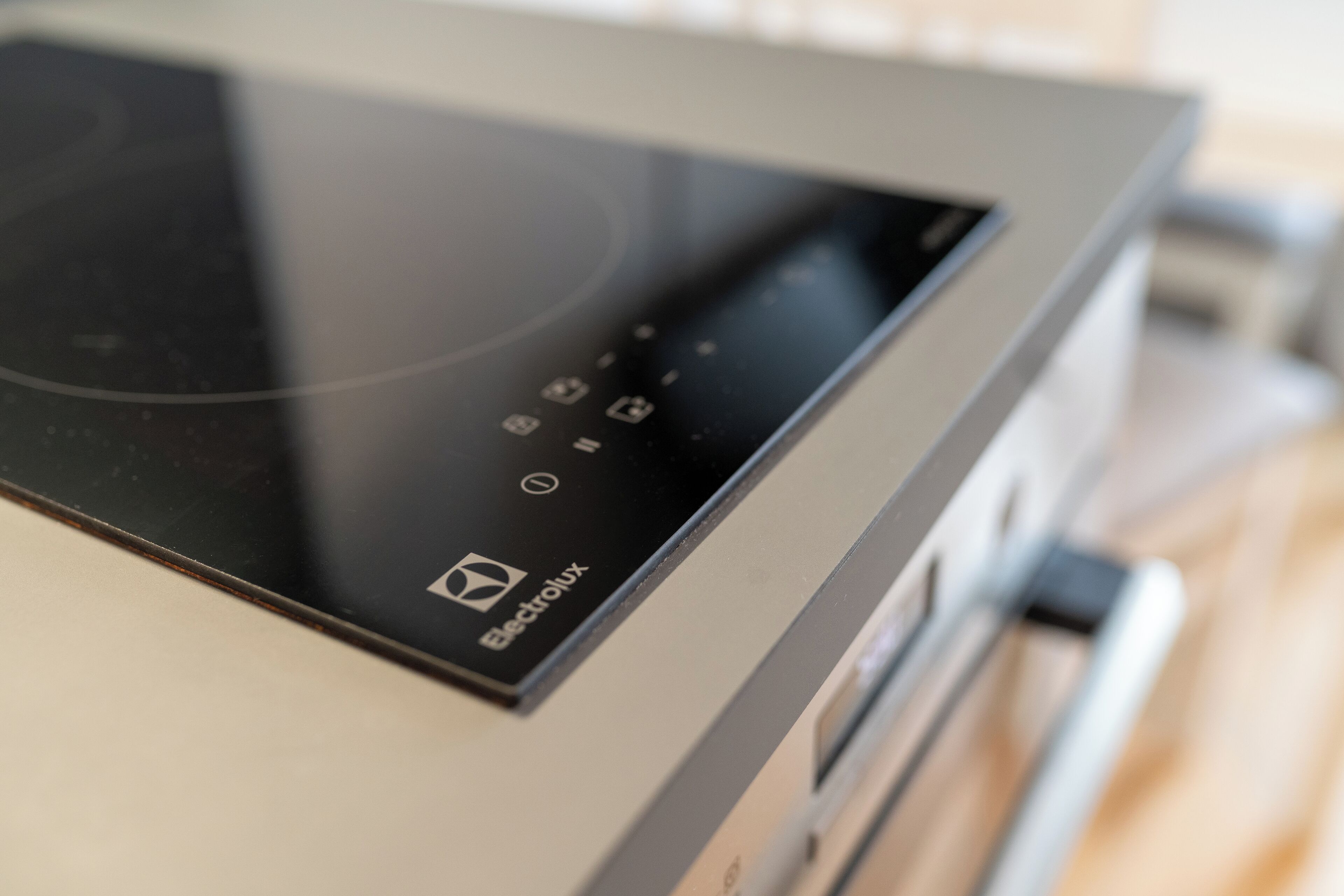 A modern kitchen with a built-in microwave and oven.