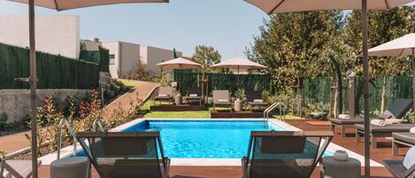 Seasonal outdoor pool, pool umbrellas, pool loungers