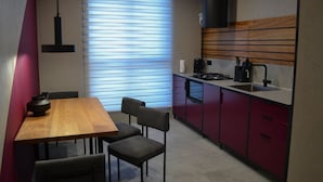 Basic Apartment | Private kitchen | Full-sized fridge, microwave, stovetop, electric kettle - Kostjukowski apartments Nekrasova 45a (Lviv)