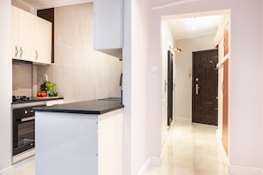 Apartamento luxo | Cozinha privada | Geladeira grande, fogão, cooktop, lava-louças