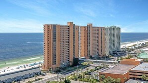 A high-rise hotel with multiple floors, located near a beach with a clear view of the ocean. - Splash 2002E BEAUTIFUL UNIT WITH GREAT VIEWS! (Panama City Beach)