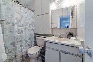 Bathtub, hair dryer, towels, soap