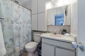 Bathtub, hair dryer, towels, soap