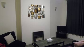 House | Living room | 30-inch TV with cable channels, fireplace