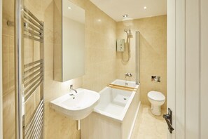 Bathtub, hair dryer, towels