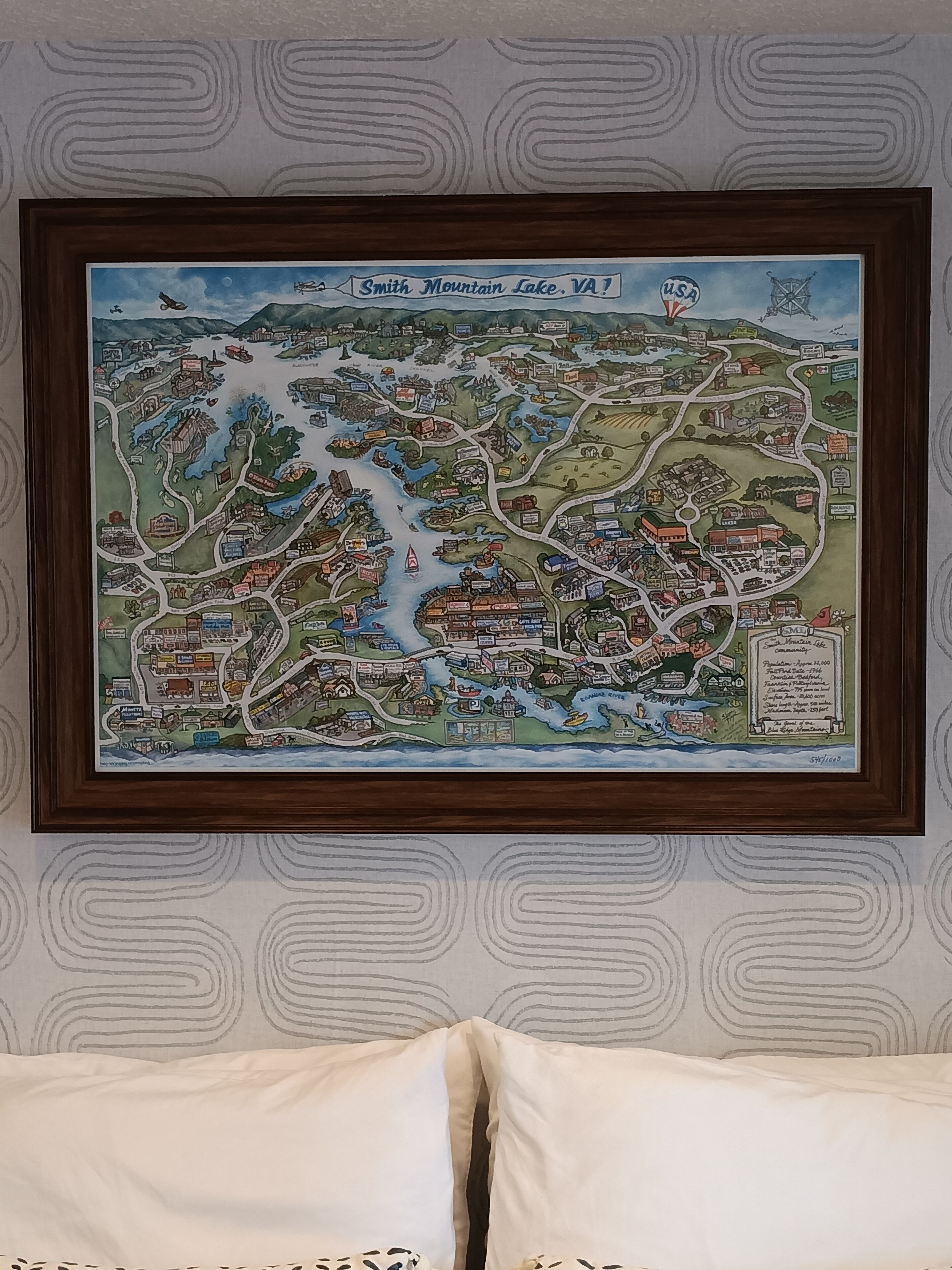 A framed map of Smith Mountain Lake, VA, depicting various buildings, roads, and landmarks.