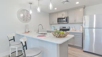 Premier Condo, 1 Bedroom, Balcony, Harbor View (203) | Private kitchen | Oven, stovetop, dishwasher, coffee/tea maker