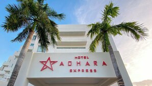 A hotel sign with a star logo and the name 'HOTEL ADHARA EXPRESS'. - Adhara Express (Cancun)
