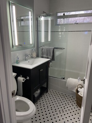 Bathtub, hair dryer, towels