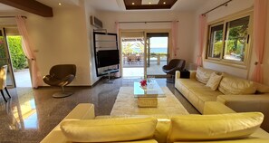 Villa, Multiple Beds | Living room | 30-inch TV with cable channels, fireplace - Stunning 5-bed Beach Front Villa, Private Beach (Mazotos)