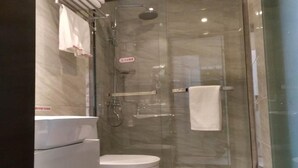 A modern bathroom with a glass-enclosed shower, a toilet, and a sink. - Shell Shanghai New International Expo Center Fanghua Road Metro Station Hotel (Shanghai)