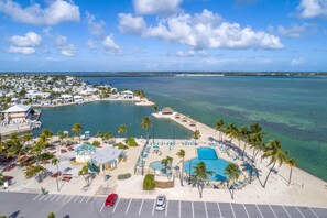 A coastal resort with a swimming pool, beach area, and a marina. - 3 night minimum! Spectacular Ocean Views! (Cudjoe Key)