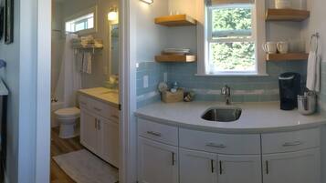 Combined shower/tub, hair dryer, towels, soap