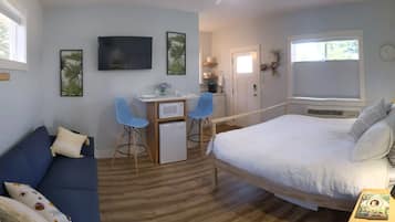 1 habitación, tabla de planchar con plancha y cuna de viaje