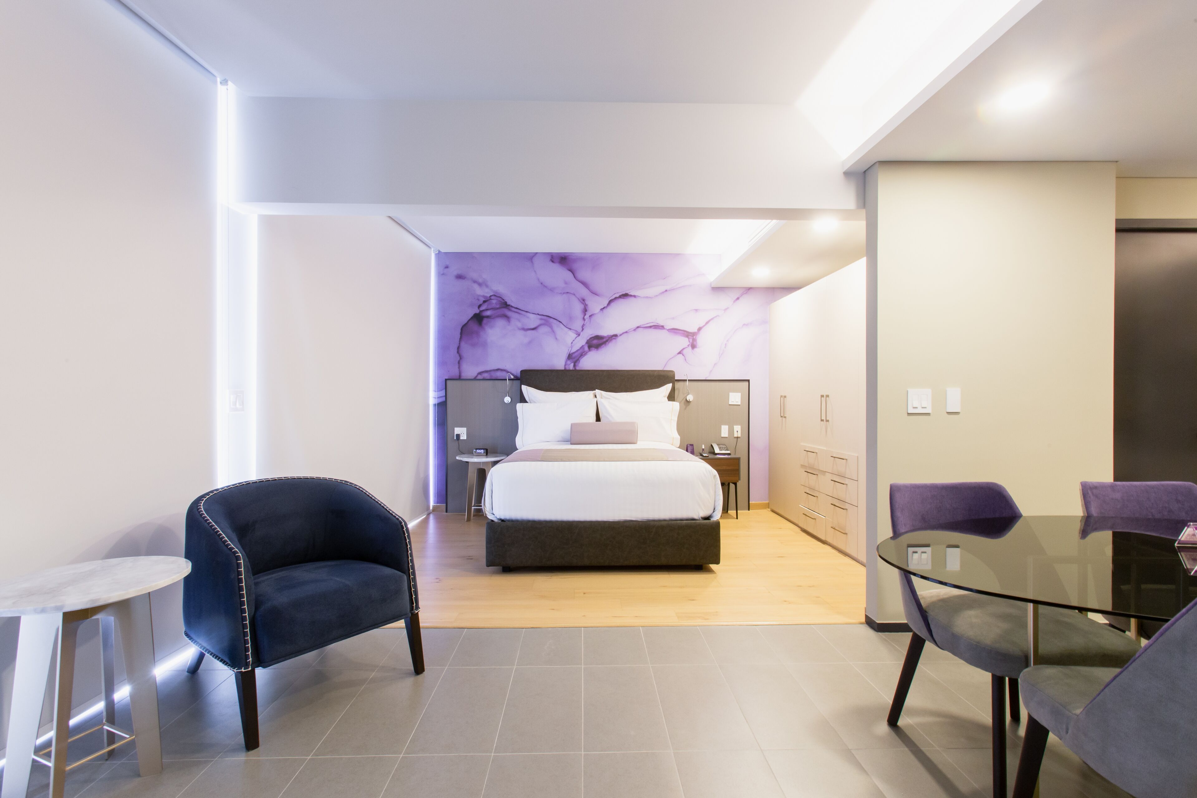 junior room, 1 queen bed, kitchenette, city view | premium bedding, down duvets, in-room safe, desk