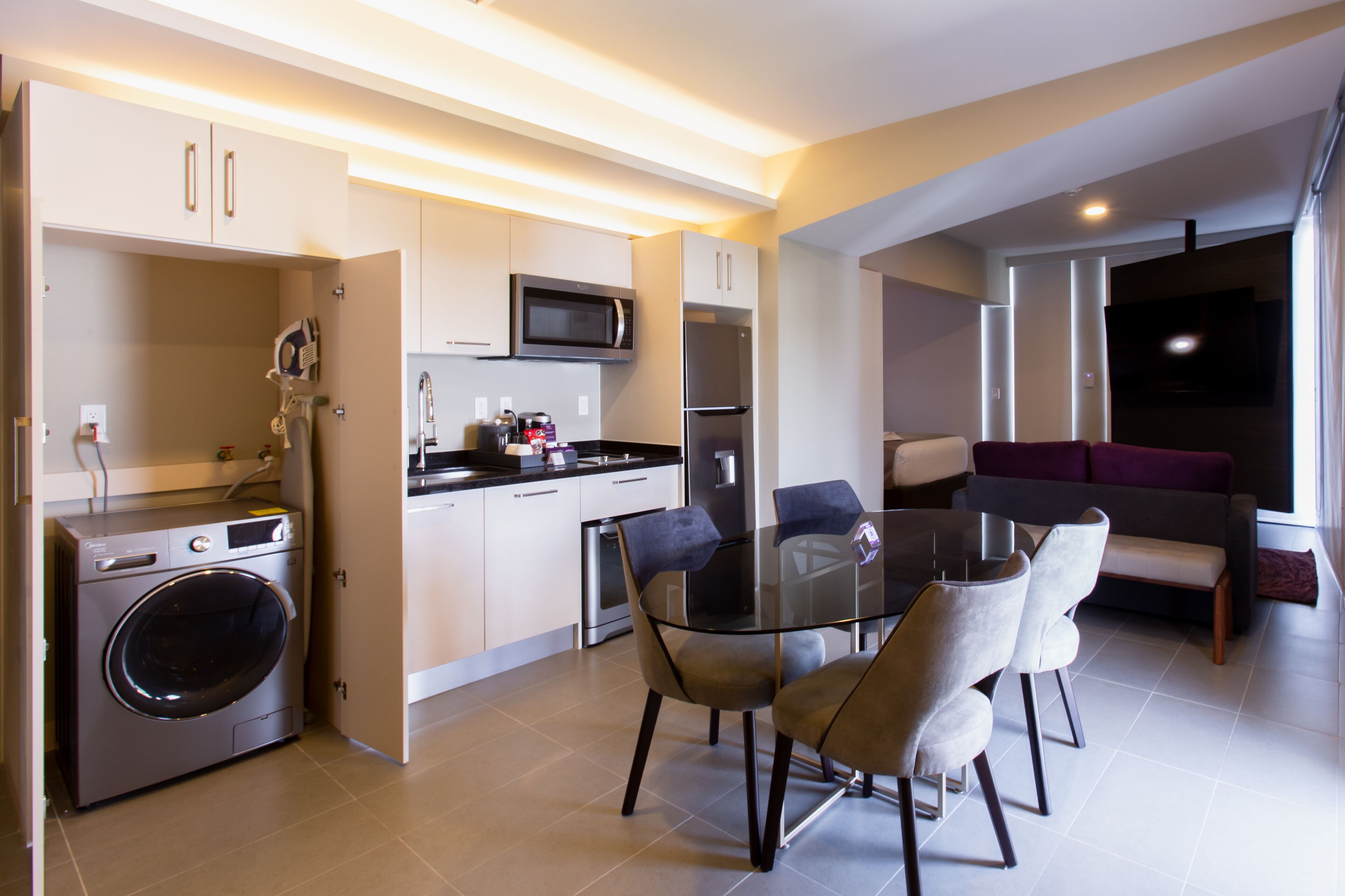 junior room, 1 king bed, kitchenette, city view | private kitchen | microwave, dishwasher, coffee/tea maker