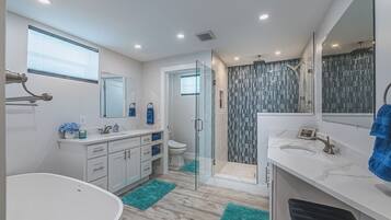 Bathtub, hair dryer, bidet, towels