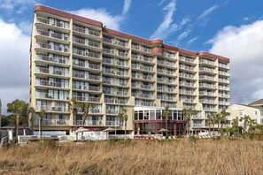 A multi-story hotel with numerous balconies and a central entrance. - Two Bedroom Deluxe, Ocean View, Luxury Condo, Myrtle Beach SC  2551978 (Myrtle Beach)