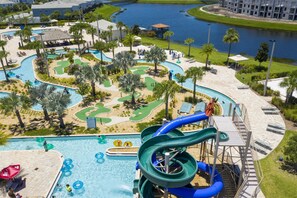 A water park with a large pool, slides, and a golf course.
