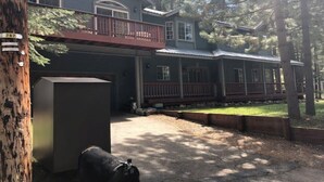 A two-story house with a balcony, a covered porch, and a mailbox. - HAKUNA MATATA  (South Lake Tahoe)