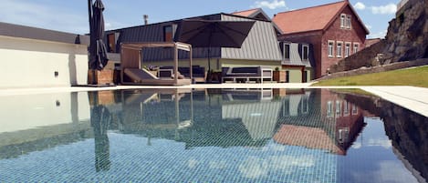 Indoor pool, seasonal outdoor pool, pool umbrellas, pool loungers