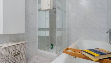 Bathtub, hair dryer, towels