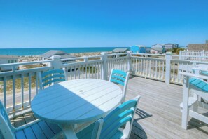 Outdoor dining - Experience 1 Coastal Escape: a spacious 5-bedroom oceanview retreat in Oak Island. (Oak Island)