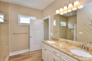 Bathtub, towels - Atlantic Waves: 7-bedroom oceanfront retreat in Oak Island, perfect for large groups. (Oak Island)
