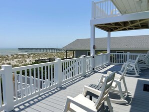 Property grounds - Beach Tonic: Oceanfront retreat in Oak Island, this 5BR home accommodates up to 12 guests. (Oak Island)