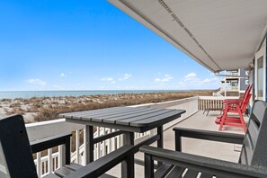 Outdoor dining - Breakwaters: Oceanfront oasis in Oak Island, offering 4 bedrooms and stunning views! (Oak Island)