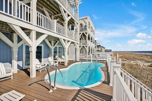 A heated pool - Experience oceanfront luxury at Chasing the Sun, a spacious 7-bedroom retreat in Oak Island. (Oak Island)