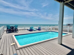 Outdoor dining - Experience oceanfront luxury at Cordoba, a spacious 7-bedroom retreat in Oak Island! (Oak Island)