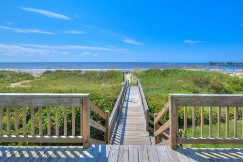 Experience beachside luxury at H2O 365, a 5-bedroom home in Oak Island!